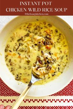 instant pot chicken wild rice soup in a white bowl with a spoon on the side