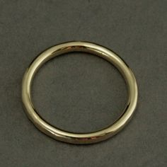 -->MATERIAL: 14K Gold (Your Choice of Color) -->DIMENSIONS: Approximately 2.25mm wide and 1.8mm thick The Lava Ring begins as solid gold 2mm full round gold stock. We then forge it to your size and apply a hammered texture. The finished ring measures approximately 2.25mm wide by 1.8mm thick and features a comfort fit inside edge. This band is perfect as a wedding band or stacked in a set. We know customizing your jewelry is both fun and necessary, so the Lava Band comes in your choice of e Wedding Band Simple, Gold Stacking Ring, Gold Stock, Faceted Ring, Classic Wedding Band, Hammered Band, Palm Coast, Ring Wedding Band, Gold Ring Stack