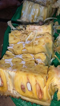 several pieces of pineapple sitting on top of a green tray