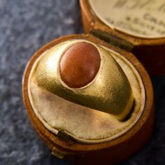 This classic vintage mens ring features a flush set oval cabochon cut orangey-brown jadeite jade.  The  ring is finished with a cross satin finish.  It is crafted in 14k yellow gold and is currently a size 9.5.  The shank is slightly flat at the base. Bear Face Drawing, Bear Face, Jade Ring, Mens Ring, Oval Cabochon, Classic Vintage, Satin Finish, Jade, Jewelry Rings