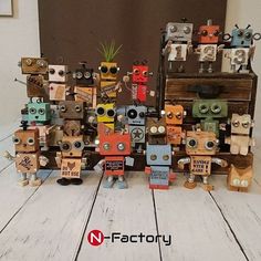 several wooden toy robots are stacked on top of each other