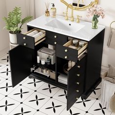 a bathroom vanity with two drawers and a sink in the middle, next to a potted plant