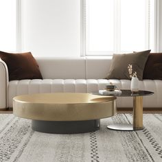 a living room with a white couch and coffee table