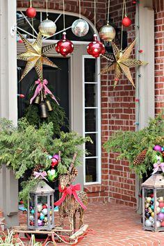 christmas decorations on the front porch of a house