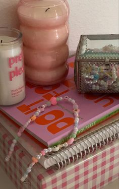 a stack of books and other items sitting on top of a table