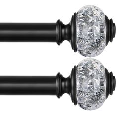 two black handles with crystal knobs on them