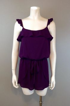 This romper is so fun and flirty! With ruffled straps and a sash, it's fully lined with a button on the back. Pair it with a pair of sexy shoes, a flashy purse, and statement earrings to complete the look.You'll be ready for that summer date or night out in this sassy little number! Fabric: 100 % polyester Made in the USA Form Fitting Dress, Ruffle Romper, Medium Purple, Dainty Earrings, Pet Hair, Perfect Summer, Online Boutique, Statement Earrings, Night Out