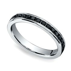 a white gold ring with black diamonds