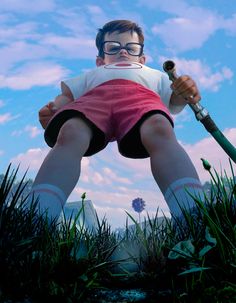 a man in shorts and glasses is holding a baseball bat while standing in the grass