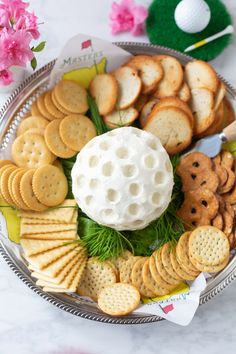 a golf themed platter with crackers and cheese