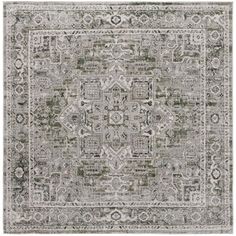 a gray and white rug with an intricate design