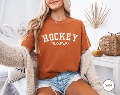 Hockey Mama Shirt, Comfort Colors Hockey Mom T-shirt, Sports Mom Gift, Hockey Season, Game Day Tee UNISEX T-SHIRTS Comfort Colors Unisex T-shirt - 100% ring-spun cotton (fiber content may vary for different colors) - Medium fabric - Relaxed fit SIZING AND COLORS - Please refer to the size chart in the listing photos for detailed sizing information - For an oversized look, we recommend sizing up two sizes - All products are true-to-fit unisex sizing SHIPPING AND PRODUCTION TIME - Production: 1-3 days - Standard Shipping: 3-5 business days after production time HOW TO ORDER - Choose your shirt color - Choose your size - Verify all order information is correct CARE INSTRUCTIONS - To preserve the design, wash inside out with warm water and mild detergent - Do not dry shirts on high heat as thi Sports Mom Gifts, Hockey Season, Hockey Mom, Sports Mom, Mama Shirt, Mom Gift, Shirt Color, Game Day, Warm Water