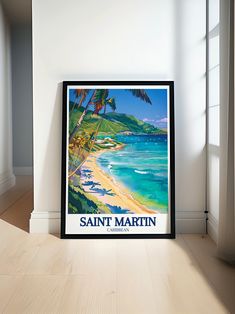 there is a framed poster on the wall next to a window that says saint martin