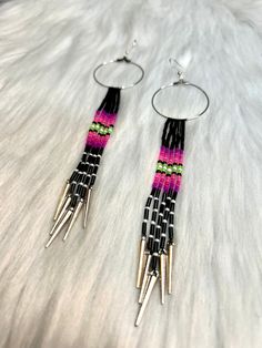 These gorgeous earrings are mvskoke-made, punk-inspired earrings in the Deadly Collection. We are an Indigenous-owned and operated business based in Mvskoke Territory in Oklahoma and strive for designs and products that are quality, affordable, and unique. We are always taking commissions and custom orders & send regular updates and confirmations because it's important to us that we are bringing your ideas to life. Most custom orders can be completed and shipped in five days, but this may vary d Punk Style Single Drop Earring, Punk Dangle Earrings For Party, Punk Style Dangle Earrings As A Gift, Punk Style Drop Earrings For Pierced Ears, Punk Drop Earrings For Party, Punk Style Drop Earrings For Party, Punk Party Drop Earrings, Edgy Pink Metal Jewelry, Handmade Punk Drop Earrings