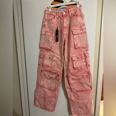 Pink Washed Cargo Jeans Size 5 New. Never Worn Pink Baggy Cargo Jeans For Spring, Pink Baggy Cargo Style Bottoms, Casual Pink Cargo Jeans With Pockets, Summer Pink Cotton Cargo Jeans, Red Baggy Jeans With Pockets, Pink Cotton Cargo Jeans For Summer, Pink Cargo Jeans For Spring Streetwear, Pink Baggy Straight Leg Cargo Jeans, Pink Wide Leg Utility Pants