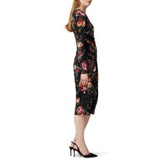 Black floral printed crepe (90% Polyester, 10% Elastane). Sheath. Long sleeves. Crew neckline. Hidden back zipper with hook-and-eye closure. Fully lined. 44" from shoulder to hemline. Imported. Printed Fitted Knee-length Floral Dress, Fitted Floral Printed Knee-length Dress, Fitted Knee-length Printed Floral Dress, Fitted Knee-length Floral Printed Dress, Floral Print Bodycon Sheath Dress, Evening Floral Print Bodycon Dress, Knee-length Floral Print Dress For Formal Events, Formal Floral Print Midi Dress, Floral Print Sheath Midi Dress For Date Night