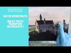 a person in blue gloves holding up a photo with the words wax on wednesday's inkjet photos on encaustic