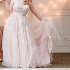 a woman in a wedding dress holding a bouquet