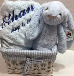 a stuffed rabbit sitting in a basket