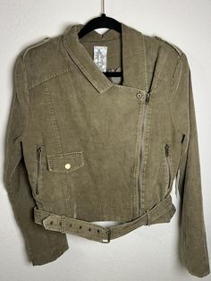 Sadie & Sage Women's Large Jacket Olive Corduroy Biker Asymmetric Belted Crop Lined and must be hand washed. Laying flat armpit to armpit is approx. 19 inches, full length from shoulder seam to hem is approx. 19 inches.  Color is called washed olive. No visible damage or wear but please look over photos closely before purchasing and feel free to message me with any questions.  All items come from a dog friendly home.  Returns are accepted, with me paying return shipping. I do offer combined ship Cotton Long Sleeve Biker Jacket For Spring, Fitted Casual Cotton Biker Jacket, Trendy Cotton Biker Jacket For Spring, Fitted Cotton Biker Jacket With Pockets, Casual Fall Cotton Biker Jacket, Casual Outerwear With Asymmetrical Zip And Pockets, Casual Biker Jacket With Asymmetrical Zip And Pockets, Large Jacket, One Pound