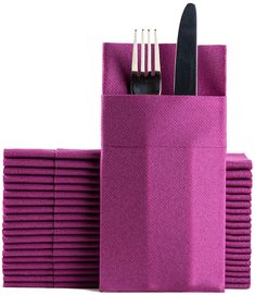 a stack of purple napkins with forks and knives in them