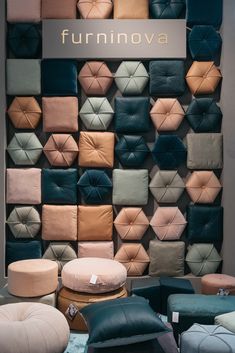 the furniture store has many different colored cushions on it's display wall, and there is