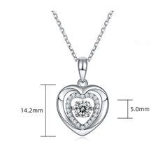 An eye-catching round moissanite dances with ease at the center of this appealing women's necklace, expressing your unstoppable love. Additional round gem set in sterling silver frame the center. Features Moissanite was originally found in meteorites(Chemical name: Silicon Carbide). It was first discovered in 1893, while a scientist was examining meteor samples from a crater in Arizona. After many years, the experts has been recreated moissanite in the laboratory, that make the gemstone with fri Double Heart Necklace, Marriage Gifts, Moissanite Necklace, Double Heart, Moissanite Jewelry, Round Moissanite, Stone Cuts, Timeless Jewelry, Silver Frame