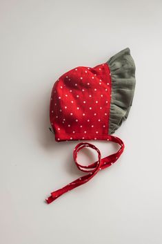 a red hat with white polka dots on it