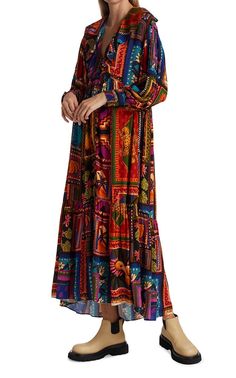 This button-front ankle dress features a ruffled neckline and bold print inspired by the vibrant colors and culture of Farm Rio's home city, Rio de Janeiro.V-neckLong sleevesSmocked cuffsButton-front closure100% rayonLining: ViscoseMachine wash Colorful Bohemian Long Sleeve Maxi Dress, Multicolor Folk Dress With Boho Print, Multicolor Folk Maxi Dress For Vacation, Bohemian Multicolor Print Midi Dress, Multicolor Printed Maxi Dress For Fall, Bohemian Long Sleeve Maxi Dress With Abstract Print, Bohemian Long Sleeve Midi Dress With Vibrant Print, Bohemian Multicolor Pattern Midi Dress, Multicolor Folk Style V-neck Dresses