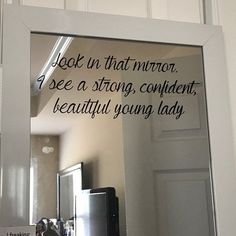 a mirror with the words look in that mirror, see a strong, confident, beautiful young lady