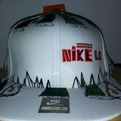 a white hat with the nike logo on it