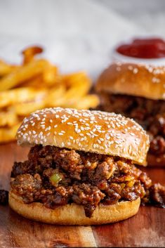 two sloppy joe sandwiches with fries on the side