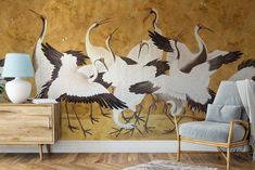 there are many birds painted on the wall