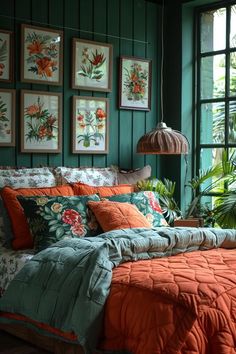 a bedroom with green walls and orange bedding