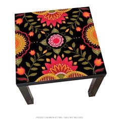 an artistically designed stool with flowers and leaves painted on the top, sitting in front of a white background