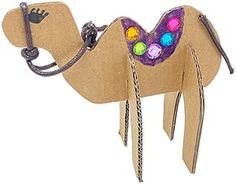 a cardboard camel with beads on it's back