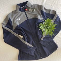 Brand New With Tags! Comfortable, Durable, Mobile, Athletic-Those Are Words That You Might Use To Describe Something Very High-Tech. And So We Are. This Under Armour Women's Navy Futbolista Jacket Is Perfect For Women Who Want To Make Sure That They're Just As Comfortable Going Out For A Run In The Rain As They Are Enjoying A Pleasant Day. Navy/Charcoal Loose: Generous, More Relaxed Fit. Smooth Tricot Knit Fabric Is Tough, With A Soft, Brushed Interior To Trap Warmth Material Wicks Sweat & Dries Sporty Gray Track Jacket For Outdoor, Athletic Heather Long Sleeve Outerwear For Fall, Gray Sportswear Track Jacket For Outdoor Activities, Gray Track Jacket For Outdoor Activities, Fall Sports Outerwear By Under Armour, Under Armour Sporty Streetwear Outerwear, Gray Track Jacket For Outdoor Activities In Fall, Heather Grey Athleisure Outerwear For Fall, Sporty Heather Grey Fall Outerwear