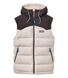 Classic, warmth and versatile: our popular Mountain Classic Down Vest now comes in a hooded style for extra comfort. Best with midweight layer. Falls at hip. Slightly Fitted. PFC/PFAS-free durable water repellent (DWR). Lining: 100% recycled polyester. Piecing at shoulders and hood: 100% nylon. Shell: 100% recycled polyester ripstop fabric. Machine wash and dry. Weight: 1. 25 lbs. Zipper: Center front closure Water Resistant: Yes Pockets: Two zip hand pockets Insulation: 650-fill DownTek™ water- Sporty Outdoor Hooded Jacket With Padded Collar, Sporty Hooded Jacket With Padded Collar For Outdoor, Casual Hooded Jacket With Padded Collar For Outdoor Activities, Casual Hooded Jacket With Padded Collar For Outdoor, White Midweight Winter Outerwear, White Midweight Outerwear For Winter, Hooded Vest, Ripstop Fabric, Down Vest