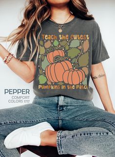 Floral Pumpkin Teacher Shirt, Boho Fall Pumpkin Teacher Shirt, Retro Halloween Teacher T-Shirt, I Teach The Cutest Pumpkins In The Patch Tee HOW TO ORDER ➀ Select color ➁ Select the size (Please check size chart) ✦ True to size. Size up 1-2 sizes for an oversized look. ➂ Add to cart ✦ (Optional) "Add message to Seller" on the checkout page. GARMENT FEATURES ✦ Crew neckline ✦ Direct to garment printing - no vinyl, decal, or iron-on technique ✦ Our designs are printed on the garment to last a long time and may not appear as 'glossy' or saturated as iron-on designs are. ✦ Please note that colors may appear different on different digital screens and may not be a true representation of the actual colors. ✦ Additional T-Shirt Colors and Sizes Available Upon Request ✧✧Brands: Bella Canvas Unisex Funny Orange Tops For Fall, Funny Orange Top For Fall, Funny Graphic Print Shirt For Fall, Fun Fall T-shirt With Screen Print, Fun Fall Screen Print T-shirt, Pre-shrunk Funny Tops For Fall, Fun Screen Print T-shirt For Fall, Funny Short Sleeve Tops For Fall, Floral Pumpkin