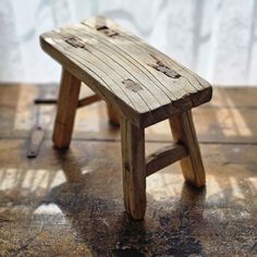 The Baby Elm Wood Stool is crafted from mid-1800's elm wood, a wood that is strong and long lasting and made without using nails or screws. These primitive pieces were created for pure function. Each features a perfectly imperfect rough-cut look with cracks and crevices that give this stool old-world charm and timeworn texture. Place accents such as vases, jars, candles or use to display small plants. Primitive Wood Furniture, Wooden Stools Diy, Old Benches, Diy Stool, Blackberry Pie, Rustic Stools, Outdoor Furniture Diy Easy, Farmhouse Fabric, Small Stool