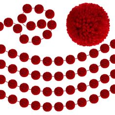 a red pom - pom garland is shown with two balls on the string