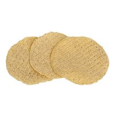 three round cork coasters sitting on top of each other in front of a white background