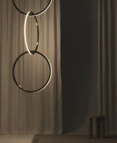 a light that is hanging from the side of a curtain