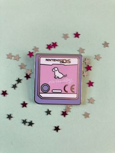 A 30mm hard enamel pin inspired by the game cartridge for the classic Nintendo DS game Nintendogs.  Your Nintendogs are always with you! Hardwearing, smooth, incredibly shiny polished silver finish with a black rubber clutch.  Please don't hesitate to get in touch with any questions. Enamel Pin Collection, Backpack Pins, Jacket Pins, Bag Pins, Game Cartridge, Pretty Pins, Cool Pins, Enamel Lapel Pin, Jewelry Pins