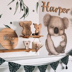 there is a wall mural with koalas and other items on the shelves next to it