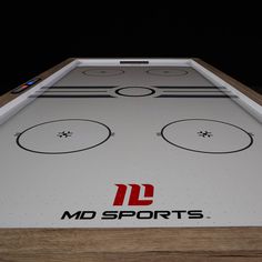 a close up of a table top with a logo on it that says md sports