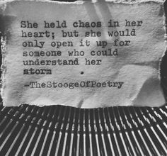 an old typewriter with a piece of paper on it that says, she held chaos in her hearty but she would only open it up for someone who could understand her storm