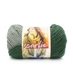 a ball of yarn that is green and has the words scarfie written on it