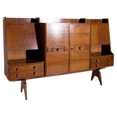 a large wooden cabinet with drawers on it