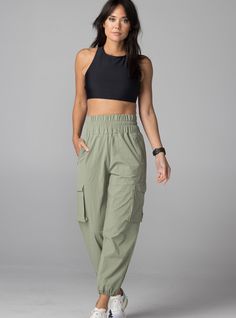 The BDlab Sportswear Cargo Pant is a flattering pull on, bold, high-waisted jogger pant that goes from hiking to casual every day to dressed up date night. Constructed with four-way stretch Japanese fabric meticulously sewn in NYC. Style it with our Cross Back Sports Bra, Every Day Tank or Long Sleeve Crew for the ultimate polished street look. Plain weave, four-way stretch 85% Nylon / 15% Poly fabric from Japan High-waisted, pull-on style 3 inch, boldly smocked elastic waistband 2 exposed zippe